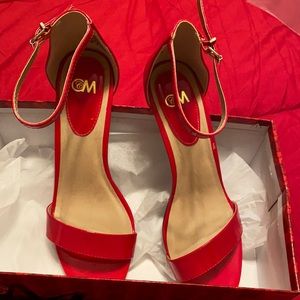 Red sandal pumps